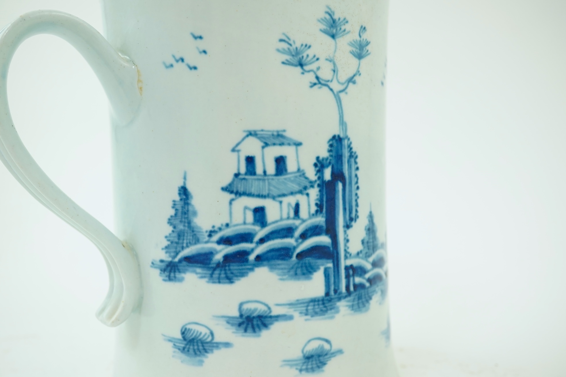 A large Worcester blue and white scratch cross type mug or tankard decorated in the Plantation pattern, c.1754-56
